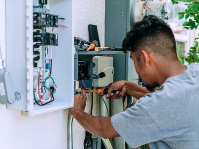 electrician fixing an electrical panel